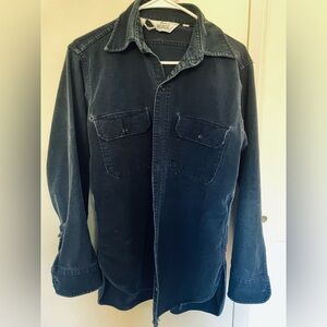 Velvety vintage Woolrich flannel shirt worn in men’s medium navy blue.